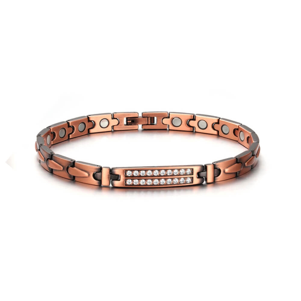 Photo sur fond blanc d'un bracelet magnétique en cuivre avec cristaux naturels de couleur bronze pour femme.