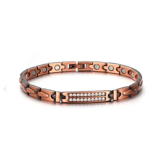 Photo sur fond blanc d'un bracelet magnétique en cuivre avec cristaux naturels de couleur bronze pour femme.