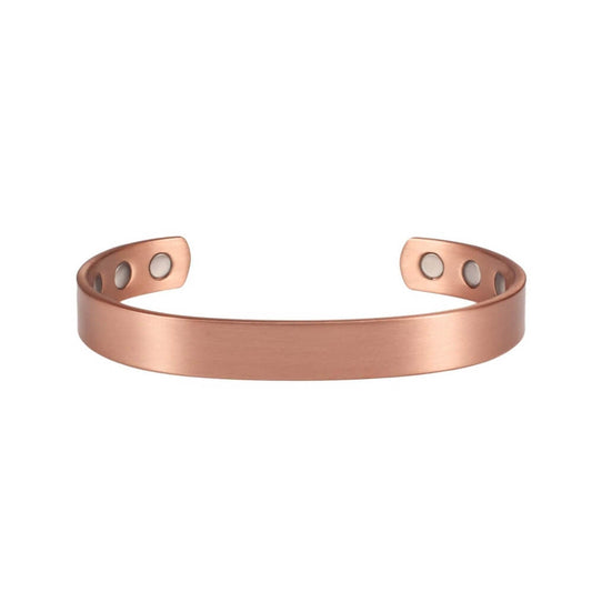 Photo sur fond blanc d'un jonc magnétique en cuivre de couleur bronze pour femme.